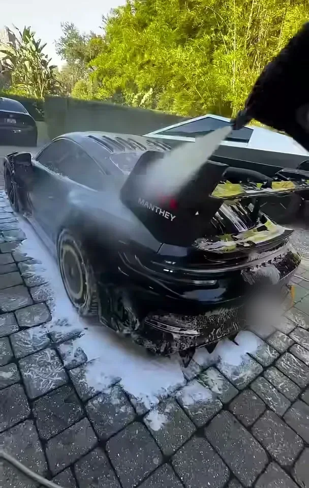 His Porsche 911 GT3 RS getting washed